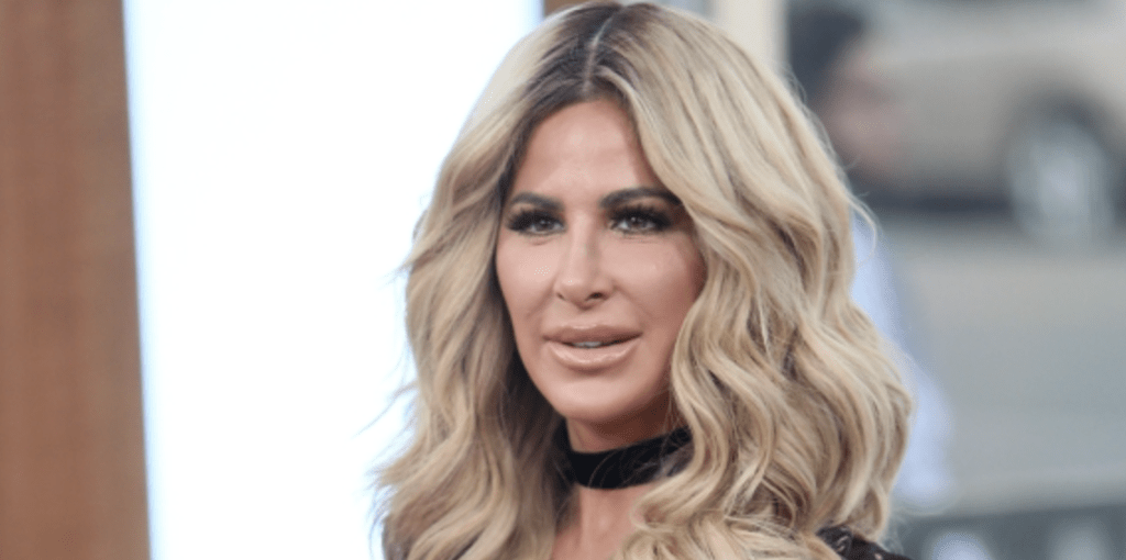 PIC: Kim Zolciak Accused of Selling Used LV Bag as “Brand New