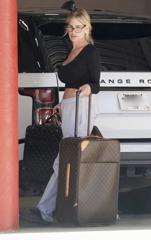 Kim Zolciak Caught Pulling Out Designer Luggage from Storage Amid